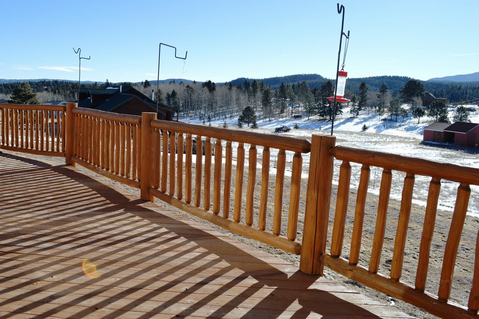 large deck large, wood deck overlooks pikes peak. this is what living in colorado is all about.