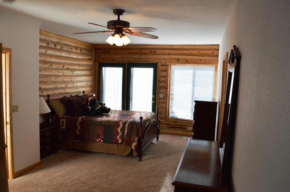 master bedroom master with walk-out to deck to enjoy the colorado sunshine.
